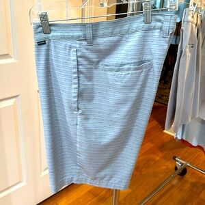 Travis Matthew’s golf shorts size 36. Light grey with blue stripes